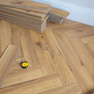 Oak Robust Natural 12mm Herringbone Laminate Flooring