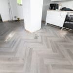 Imperial Grey Luxury Vinyl Click Flooring with a sleek grey wood-grain finish.