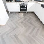 Imperial Grey Luxury Vinyl Click Flooring with a sleek grey wood-grain finish.