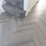 Imperial Grey Luxury Vinyl Click Flooring with a sleek grey wood-grain finish.