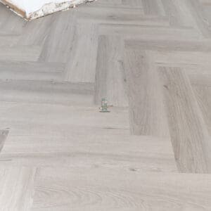 Imperial Grey Luxury Vinyl Click Flooring with a sleek grey wood-grain finish.