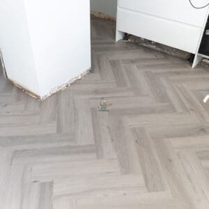 Imperial Grey Luxury Vinyl Click Flooring with a sleek grey wood-grain finish.