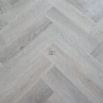 Quayside Umber Luxury Vinyl Click Flooring with soft brown tones and subtle wood grain.