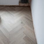 Quayside Umber Luxury Vinyl Click Flooring with soft brown tones and subtle wood grain.