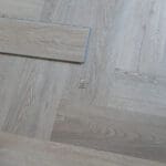 Quayside Umber Luxury Vinyl Click Flooring with soft brown tones and subtle wood grain.