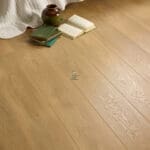 Madrid Oak 12mm Laminate Flooring with 4V Groove, showcasing warm oak tones and a realistic wood grain finish.