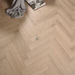 Pearl Oak AC5 Laminate Flooring with light tones and a realistic wood texture.