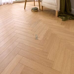 Warm golden Sunset Oak AC5 laminate flooring with realistic wood texture.