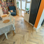 Cambridge 20/5 x 70mm Worn Cathedral Oak Herringbone Engineered Wood Flooring with light oak tones and a classic herringbone finish