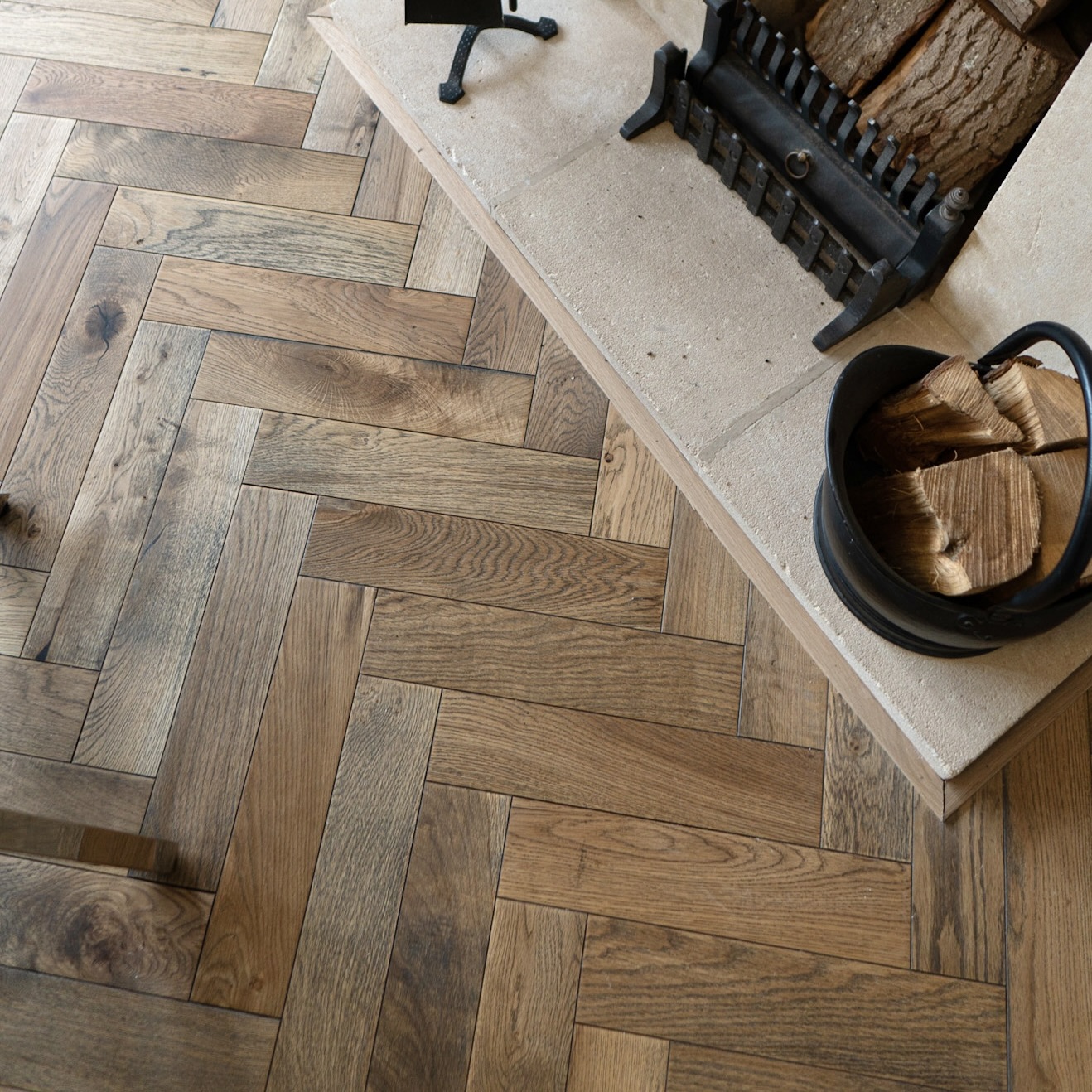 Worn Antique Oak Herringbone Engineered Wood Flooring with rich antique tones, and a classic herringbone pattern for a timeless, rustic look